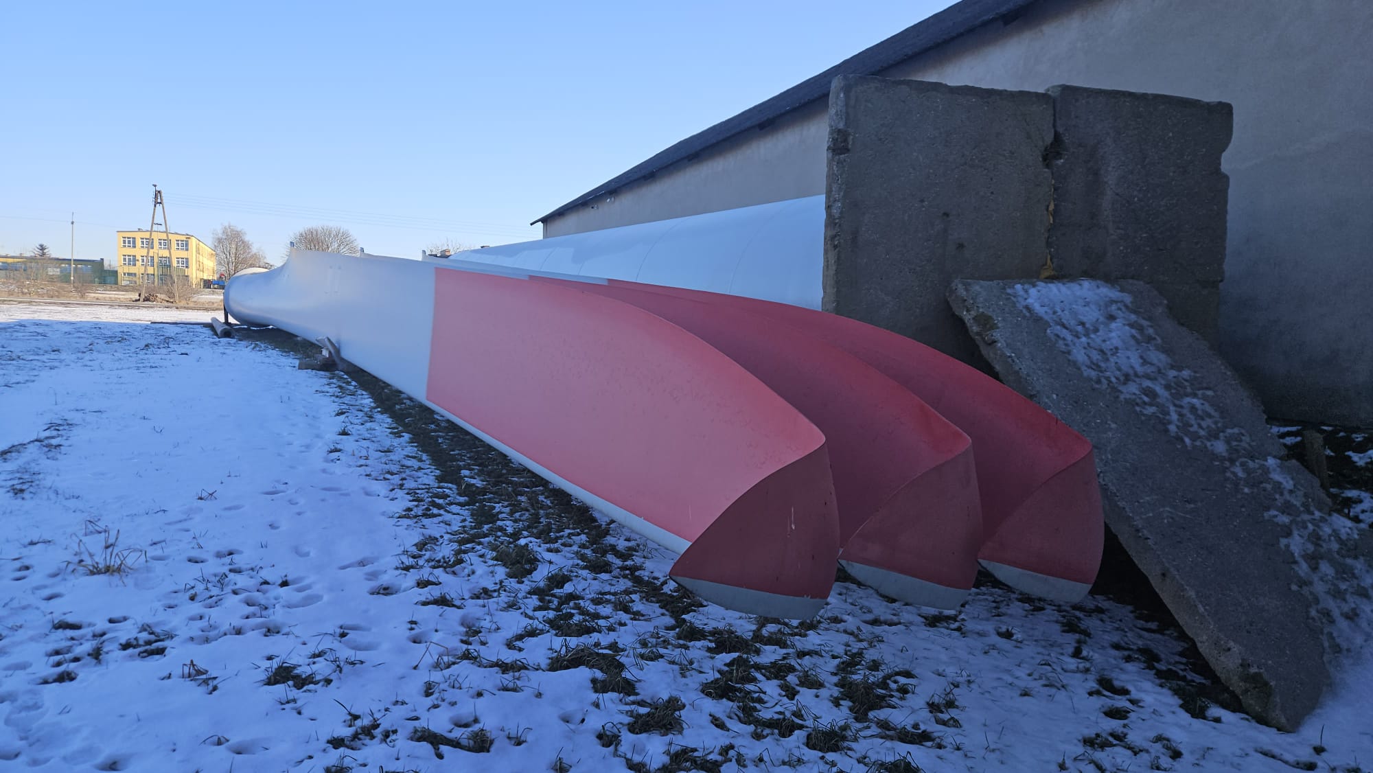 Set of three Enercon E-82 E2 rotor blades viewed from the blade roots