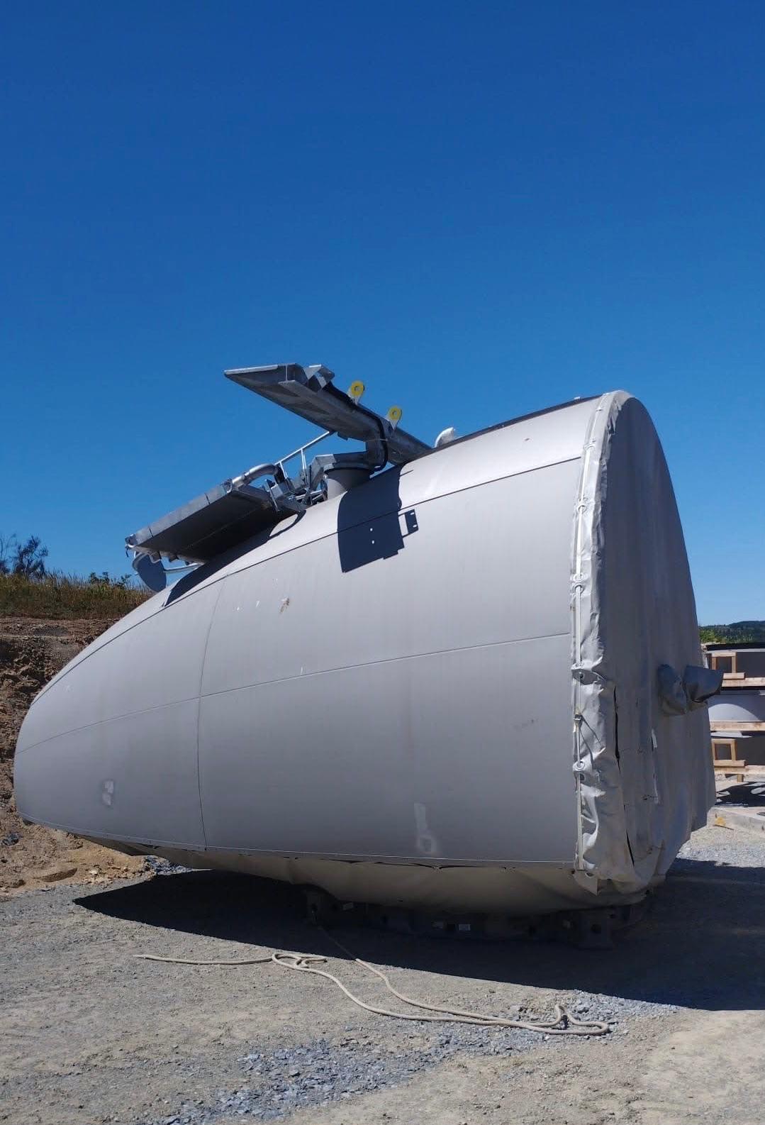 Illustrative image of a detached wind-turbine nacelle outdoors